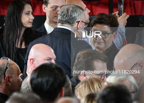 KRAKOW, POLAND - NOVEMBER 24:
Beata Szydlo (Center right), the oppositin Law and Justice party MEP, chatting with andrzej adamczyk MP, durin...