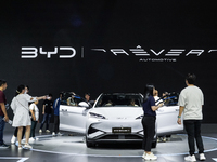 Visitors inspect a BYD SEALION 7 electric car displayed at the Thailand International Motor Expo 2024 at IMPACT exhibition center in Bangkok...