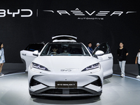 Visitors inspect a BYD SEALION 7 electric car displayed at the Thailand International Motor Expo 2024 at IMPACT exhibition center in Bangkok...