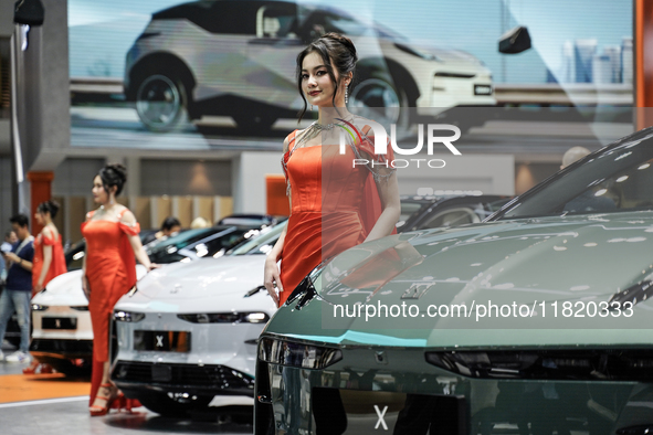 A model stands next to an electric ZEEKR X at the Thailand International Motor Expo 2024 at the IMPACT exhibition center in Bangkok, Thailan...