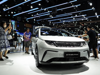 Visitors inspect a BYD DOLPHIN electric car displayed at the Thailand International Motor Expo 2024 at the IMPACT exhibition center in Bangk...