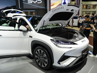 Visitors inspect a BYD SEALION 7 electric car displayed at the Thailand International Motor Expo 2024 at IMPACT exhibition center in Bangkok...