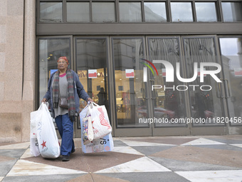 People in the United States shop for good products during the Black Friday deals in Washington, DC, USA, on November 29, 2024, at Macy's mal...