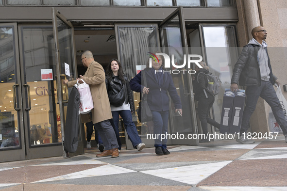 People in the United States shop for good products during the Black Friday deals in Washington, DC, USA, on November 29, 2024, at Macy's mal...