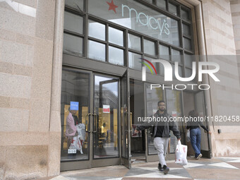 People in the United States shop for good products during the Black Friday deals in Washington, DC, USA, on November 29, 2024, at Macy's mal...