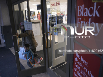 People in the United States shop for good products during the Black Friday deals in Washington, DC, USA, on November 29, 2024, at Macy's mal...