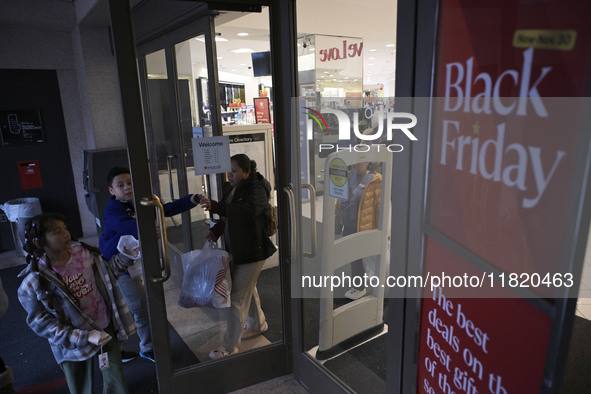 People in the United States shop for good products during the Black Friday deals in Washington, DC, USA, on November 29, 2024, at Macy's mal...