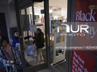 People in the United States shop for good products during the Black Friday deals in Washington, DC, USA, on November 29, 2024, at Macy's mal...