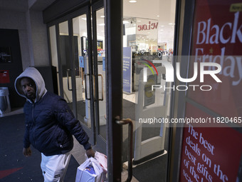 People in the United States shop for good products during the Black Friday deals in Washington, DC, USA, on November 29, 2024, at Macy's mal...