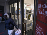 People in the United States shop for good products during the Black Friday deals in Washington, DC, USA, on November 29, 2024, at Macy's mal...