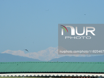 The peak of Kangchenjunga in the eastern Himalayan range is visible from Siliguri, India, on November 29, 2024. (