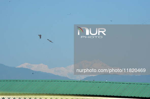 The peak of Kangchenjunga in the eastern Himalayan range is visible from Siliguri, India, on November 29, 2024. 