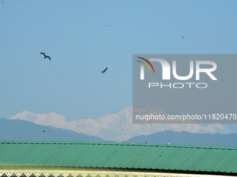 The peak of Kangchenjunga in the eastern Himalayan range is visible from Siliguri, India, on November 29, 2024. (