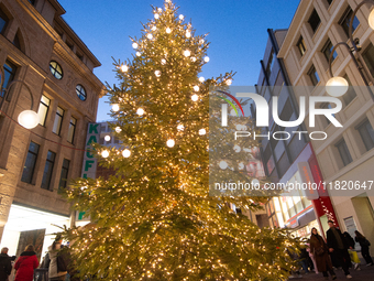 A general view of a Christmas tree is seen at the city center of Cologne, Germany, on November 29, 2024, during the Black Friday Sale. (