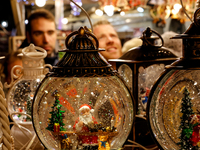 Visitors watch Christmas decorations as they walk the alleys of Krakow's Christmas Market, one of the largest such markets in Europe as it o...