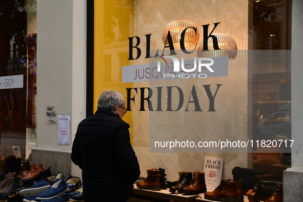 A person takes advantage of Black Friday in a shoe store in Lyon, France, on November 29, 2024. 