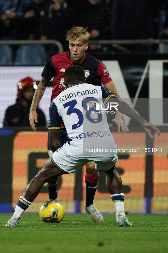 Mattia Felici (#97 Cagliari Calcio) and Jackson Tchatchoua (Hellas Verona FC) participate in the Serie A TIM match between Cagliari Calcio a...