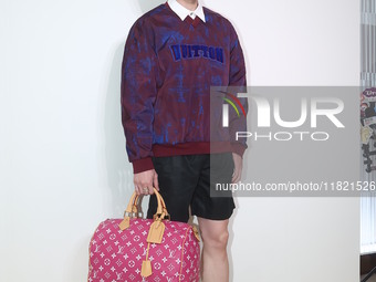 Taiwanese actor Kuang-Chen Chang attends the opening ceremony of the Louis Vuitton flagship store in Taipei, Taiwan province, China, on Nove...