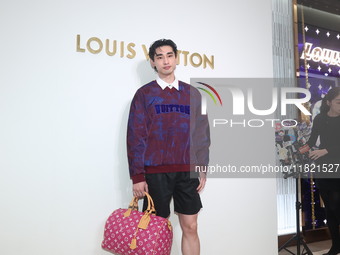 Taiwanese actor Kuang-Chen Chang attends the opening ceremony of the Louis Vuitton flagship store in Taipei, Taiwan province, China, on Nove...