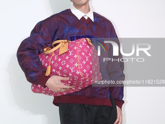 Taiwanese actor Kuang-Chen Chang attends the opening ceremony of the Louis Vuitton flagship store in Taipei, Taiwan province, China, on Nove...