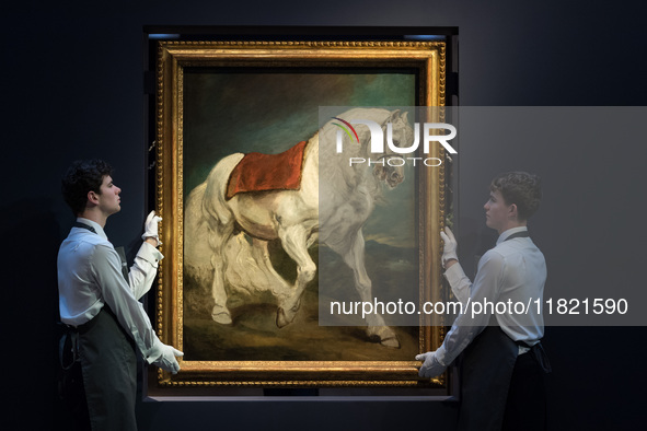 LONDON, UNITED KINGDOM - NOVEMBER 29, 2024: Art handlers hold a painting by Anthony van Dyck 'An Andalusian Horse' - his first grand-scale d...