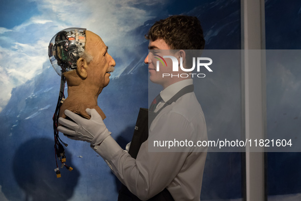 LONDON, UNITED KINGDOM - NOVEMBER 29, 2024: A staff member looks at The Einstein robotic head, developed by Hanson Robotics in 2005: a landm...