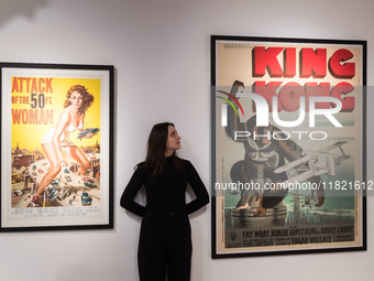 LONDON, UNITED KINGDOM - NOVEMBER 29, 2024: A staff member looks at the original 1933 film poster for 'King Kong' (estimate: GBP25,000-35,00...