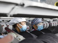 Workers work at a production workshop of a textile enterprise in Sihong Economic Development Zone in Suqian, Jiangsu province, China, on Nov...