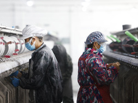 Workers work at a production workshop of a textile enterprise in Sihong Economic Development Zone in Suqian, Jiangsu province, China, on Nov...