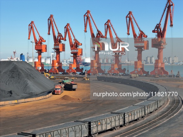 The coal transport train departs from the coal yard in Longkou Port Area, Yantai City, Shandong Province, China, on November 29, 2024. 