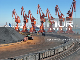 The coal transport train departs from the coal yard in Longkou Port Area, Yantai City, Shandong Province, China, on November 29, 2024. (