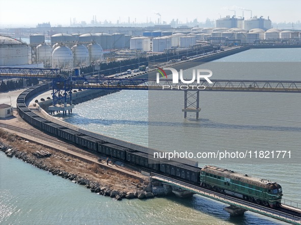 The coal transport train departs from Longkou Port Area in Yantai, Shandong Province, China, on November 29, 2024. 