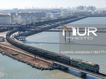 The coal transport train departs from Longkou Port Area in Yantai, Shandong Province, China, on November 29, 2024. (