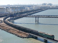 The coal transport train departs from Longkou Port Area in Yantai, Shandong Province, China, on November 29, 2024. (