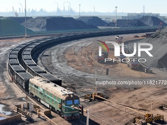 The coal transport train departs from the coal yard in Longkou Port Area, Yantai City, Shandong Province, China, on November 29, 2024. (