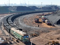 The coal transport train departs from the coal yard in Longkou Port Area, Yantai City, Shandong Province, China, on November 29, 2024. (