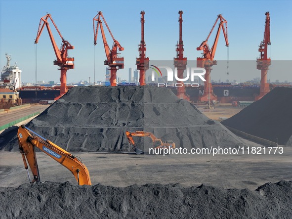 Loading machinery operates at the coal yard in Longkou Port Area, Yantai City, Shandong Province, China, on November 29, 2024. 