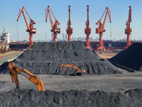 Loading machinery operates at the coal yard in Longkou Port Area, Yantai City, Shandong Province, China, on November 29, 2024. (