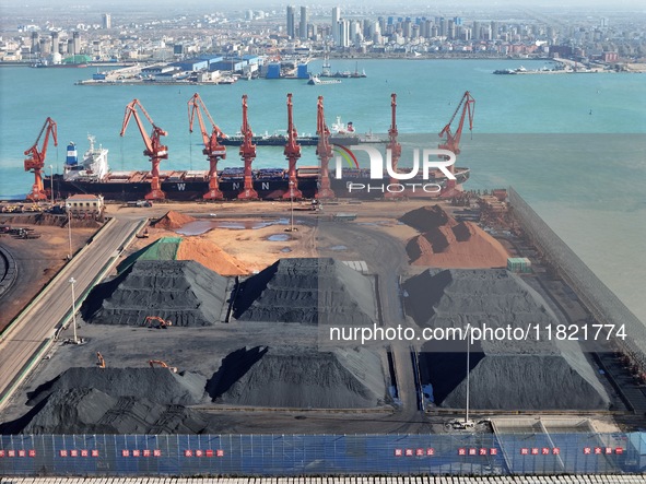 Loading machinery operates at the coal yard in Longkou Port Area, Yantai City, Shandong Province, China, on November 29, 2024. 