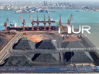 Loading machinery operates at the coal yard in Longkou Port Area, Yantai City, Shandong Province, China, on November 29, 2024. (