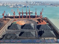 Loading machinery operates at the coal yard in Longkou Port Area, Yantai City, Shandong Province, China, on November 29, 2024. (