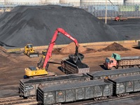 Loading machinery operates at the coal yard in Longkou Port Area, Yantai City, Shandong Province, China, on November 29, 2024. (