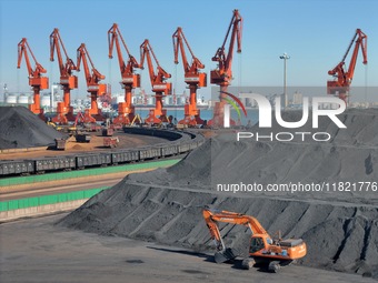 Loading machinery operates at the coal yard in Longkou Port Area, Yantai City, Shandong Province, China, on November 29, 2024. (