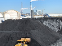 Loading machinery operates at the coal yard in Longkou Port Area, Yantai City, Shandong Province, China, on November 29, 2024. (