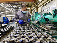 A worker works at an auto parts manufacturing enterprise in the Economic Development Zone of Qingzhou City, East China's Shandong Province,...