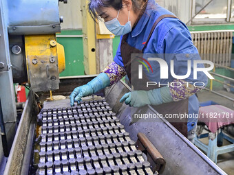 A worker works at an auto parts manufacturing enterprise in the Economic Development Zone of Qingzhou City, East China's Shandong Province,...