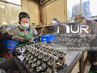 A worker works at an auto parts manufacturing enterprise in the Economic Development Zone of Qingzhou City, East China's Shandong Province,...