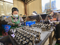 A worker works at an auto parts manufacturing enterprise in the Economic Development Zone of Qingzhou City, East China's Shandong Province,...