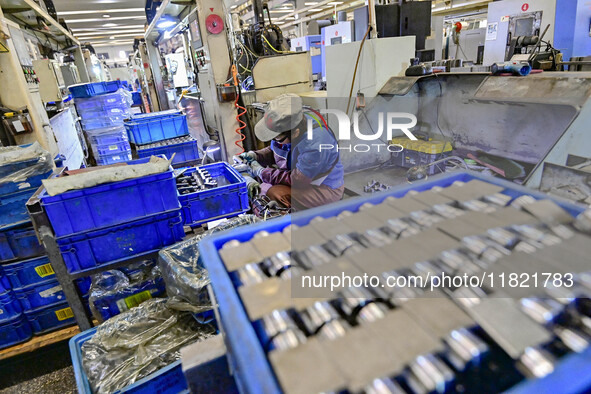 A worker works at an auto parts manufacturing enterprise in the Economic Development Zone of Qingzhou City, East China's Shandong Province,...