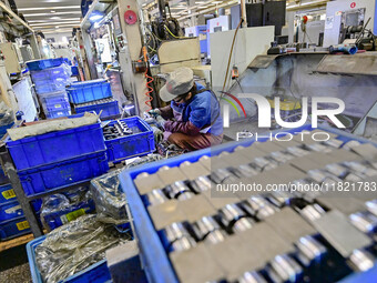 A worker works at an auto parts manufacturing enterprise in the Economic Development Zone of Qingzhou City, East China's Shandong Province,...